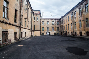 Typical Saint Petersburg courtyard wit shabby yellow walls