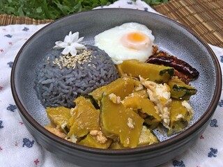 Pumpkin mixed fried egg with fried egg and blue rices and chili