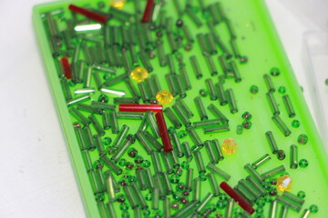 green beads on a light green background