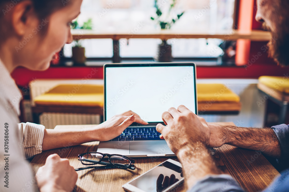 Poster cropped image of male and female remote workers downloading media file for creating new website for 