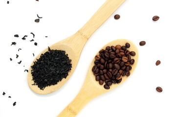 Dry herbal tea and coffee beans lie on wooden spoons and on a white background