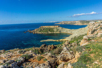 Fototapeta na wymiar Hike by Golden Bay beach in Malta with beautiful blue ocean