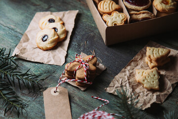 Box of Christmas cookies on rustic background