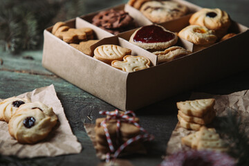 Fototapeta premium Box of Christmas cookies on rustic background