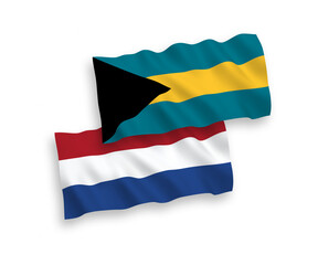 Flags of Commonwealth of The Bahamas and Netherlands on a white background