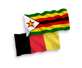Flags of Belgium and Zimbabwe on a white background