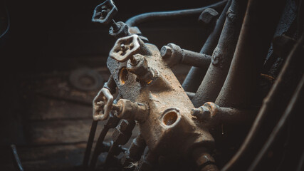 old mechanism of an abandoned steam locomotive