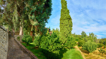 Fototapeta na wymiar Large-format panoramic view of the Yuste Monastery in summer. Palace of Carlos V. Extremadura. Spain.