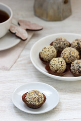 Homemade healthy candy made from dried fruits, honey and nuts. Rustic style.