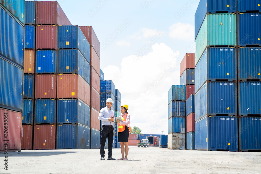 Poster manager and contenner worker working in the construction container yard,industrial container yard fo