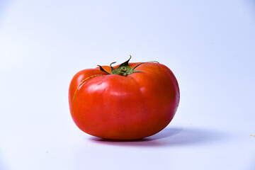 red tomato on white background