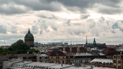 Fototapeta na wymiar Saint Petersburg cloudy cityscape with rooftops and cathedral domes