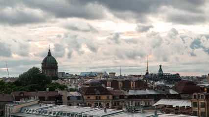 Deurstickers Saint Petersburg cloudy cityscape with rooftops and cathedral domes © Дэн Едрышов