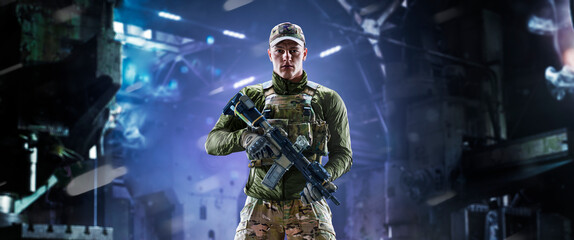 Fototapeta premium Army soldier in Protective Combat Uniform holding Special Operations Forces Combat Assault Rifle on dark background