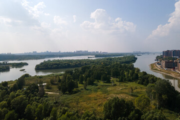 Naklejka premium modern residential complex in a large city on the river bank. view from the plane