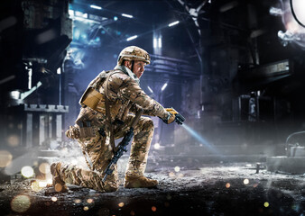 Army soldier in Protective Combat Uniform holding Special Operations Forces Combat Assault Rifle on...