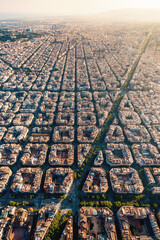 Aerial view of typical buildings of Barcelona cityscape from helicopter. top view, Eixample...