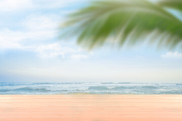 blank wood table countertop with softfocus palm and summer beach background