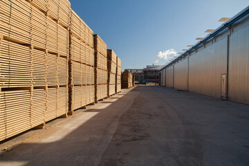 A pallet of boards in an industrial sawmill warehouse
