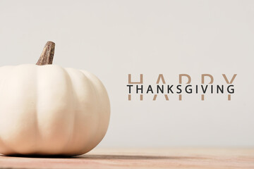 Happy Thanksgiving background greeting by white modern pumpkin for holiday.