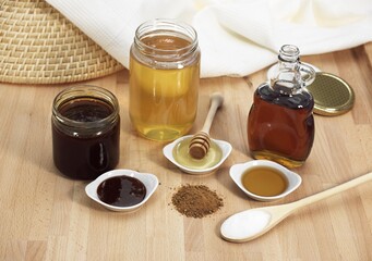 Obraz na płótnie Canvas Granulated Sugar, Brown Sugar, Maple Syrup, Treacle and Honey