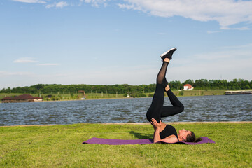 Athletic young woman stretching her hamstring, legs exercise training fitness before workout...