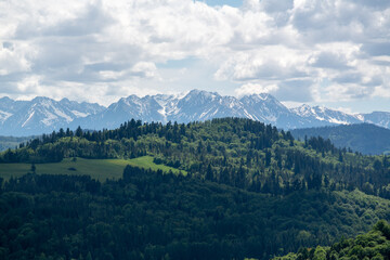 Naklejka na ściany i meble Panorama of the Tatra Mountains with snow-capped peaks