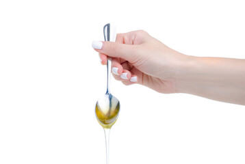 spoon with honey in hand on white background isolation