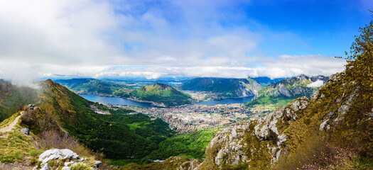 Wide panoramic view of the city of Lecco , Lake Como and lake Garlate  from the height of the mountain Resegone. Italy