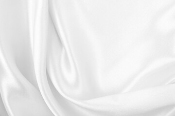 Smooth elegant white silk or satin luxury cloth texture as wedding background. Luxurious background...