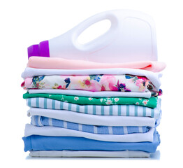 Stack folded cloth laundry with bottle liquid powder detergent on white background isolation