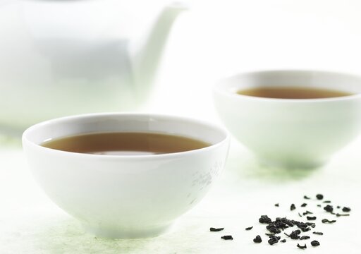 Bowl of Green Tea, Infusion against White Background