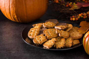 Funny Halloween cookies on black background.	