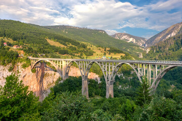 Fototapeta na wymiar Mountain landscape, Montenegro. Durdevica Tara arc bridge in the mountains, One of the highest automobile bridges in Europe.