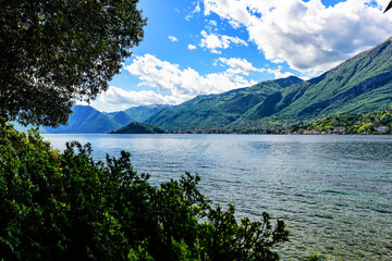 Fototapeta na wymiar The coast of Lake Como and the surrounding mountains. Italy