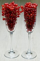 Fresh red currant berries in glass wine glasses