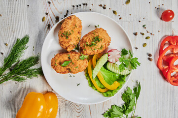 Fried chicken steak or schnitzel with mashed potatoes on black stone table.
