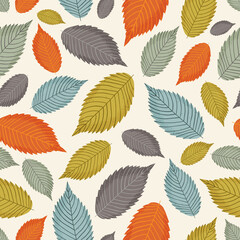 Seamless pattern with colorful autumn leaves on a beige background.