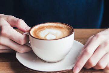 Men hands holding a cup of coffee. Blue sweater, men, cup, coffee, latte, cappuccino, comfort, day.