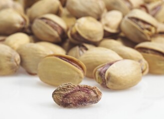 Pistachio Nuts, pistacia vera, Dry Fruits against White Background