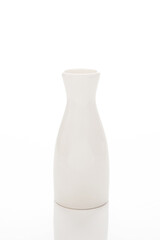 Empty white ceramic flower vase, drink jug, white tableware on a white background