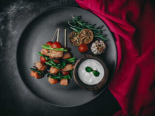Grilled Salmon  in a wooden plate with sticky with sauce , garlic and lemon slices,shiitake...