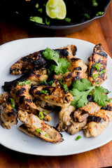 Grilled chicken. BBQ Chicken grilled in garlic and butter. Chicken, fried & served w/ bbq side dishes, organic vegetables and dressed in olive oil. Classic American outdoor grill entree favorite.