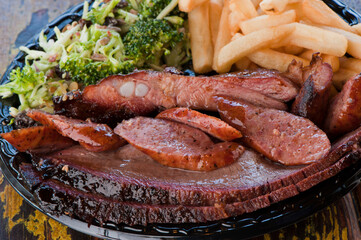 Brisket, pork sausage, pork ribs, beef ribs. Barbecue platter served with classic bbq sides Mac n cheese, cornbread, Brussels sprouts, coleslaw & beer. Classic traditional Texas meats & side dishes.