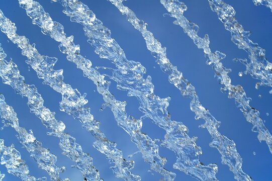 Foutain with Water Jets against Blue Sky
