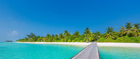 Fantastic paradise beach. Maldives island beach panorama. Palm trees and beach bar and long wooden...