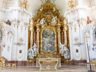 View at the altar of Marienmuenster Diessen. Interior of a richly ornamented catholic church.