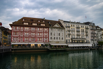 Naklejka premium Picturesque historical buildings on the embankment of Reuss river in Lucerne, Switzerland