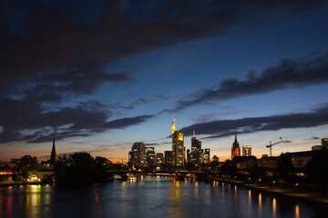 Frankfurt's skyline at evening blue hour and some lights already lit