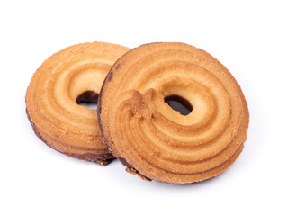 Heap of butter ring cookies with chocolate glaze on the back side